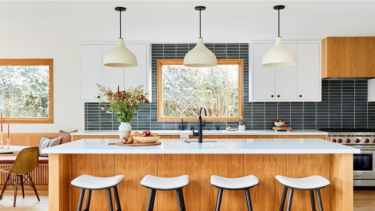 Island modular kitchen with a central counter, manufactured by Intercraft Furniture in Greater Noida
